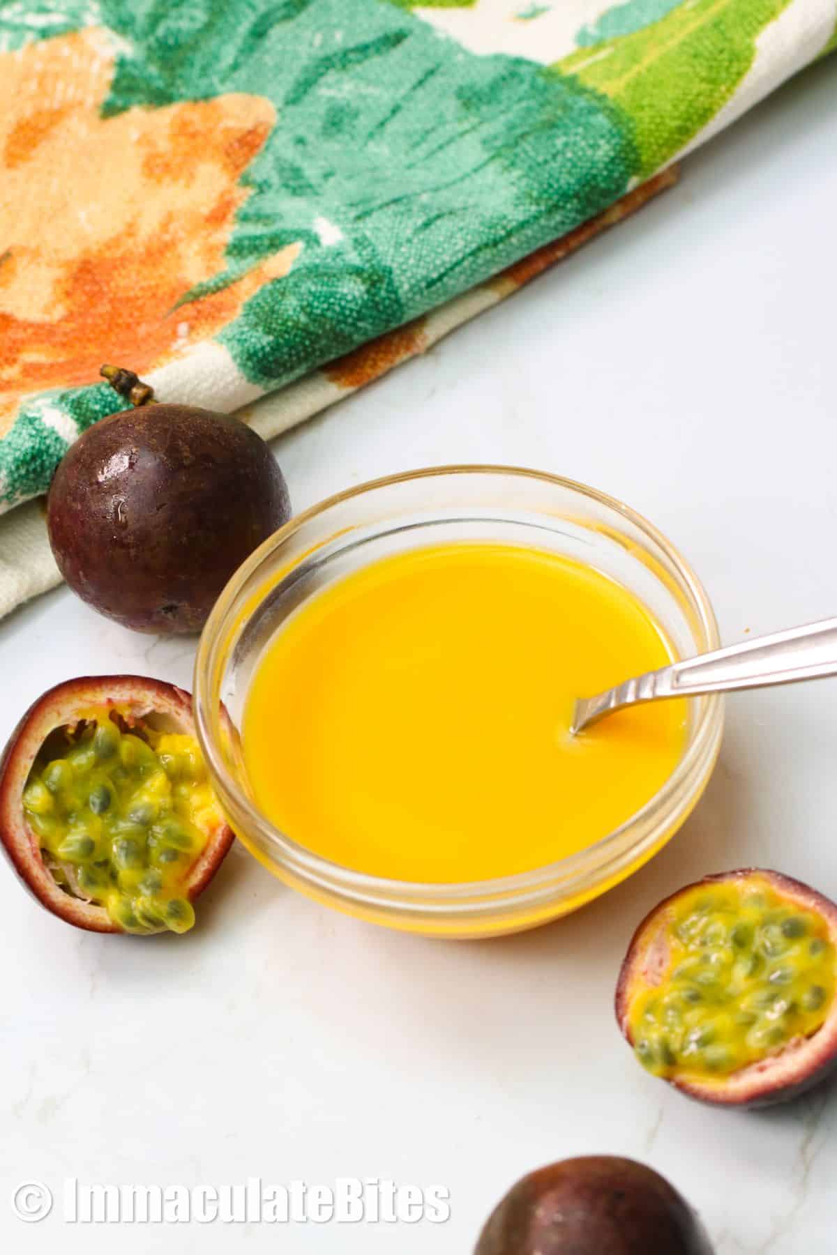 Bowl of passion fruit and passion fruit puree 