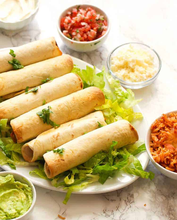 A plateful of chicken taquitos for the perfect Mexican street food collection