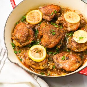 Lemon pepper chicken fresh in a cast-iron pan from the oven