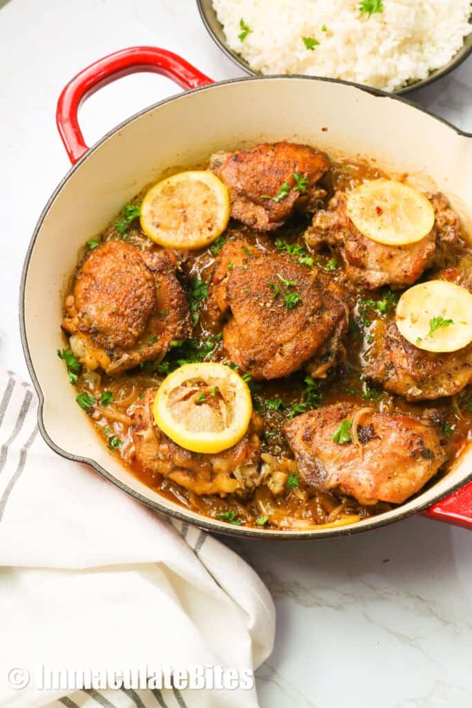 Lemon pepper chicken fresh in a cast-iron pan from the oven