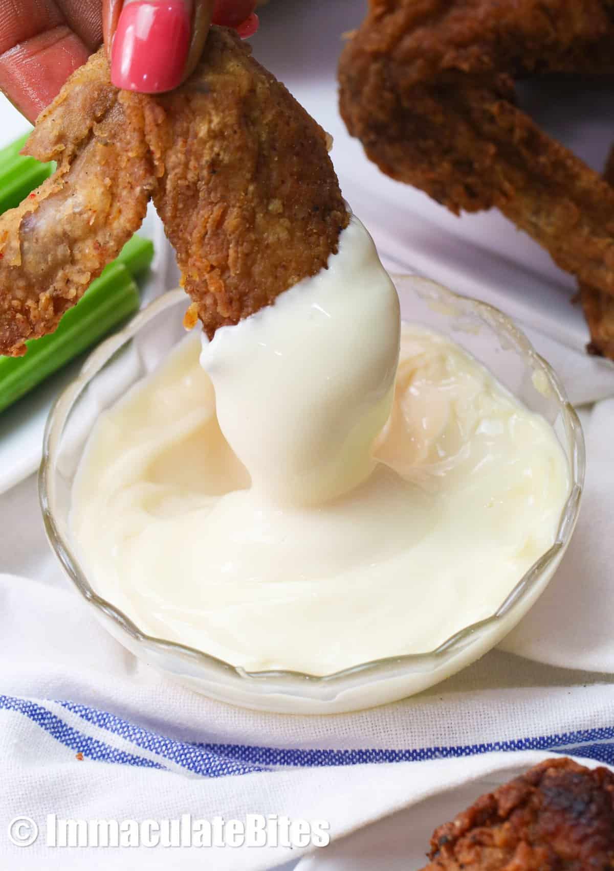 Dip fried chicken wings in remoulade