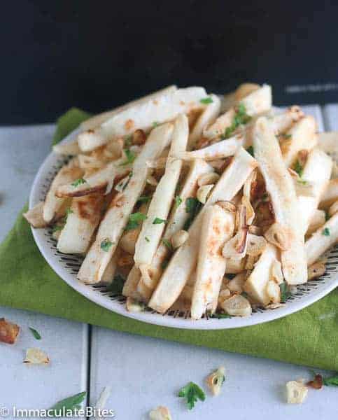 A plate full of baked crispy cassava fries