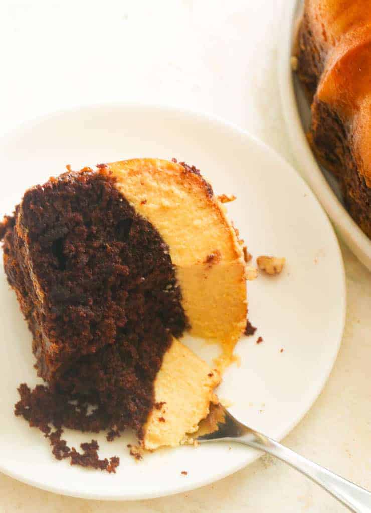 A slice of Chocoflan on a white dessert plate