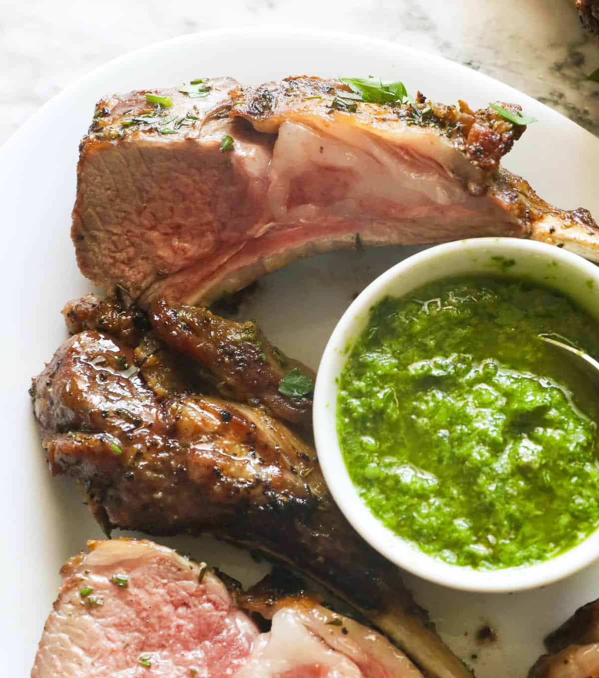 Grilled rack of lamb sliced and served with salsa verde