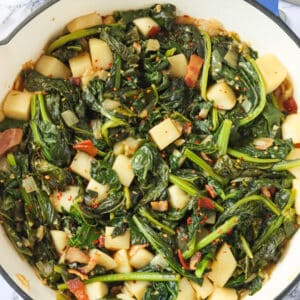 A pan full of turnips, their greens, and bacon.