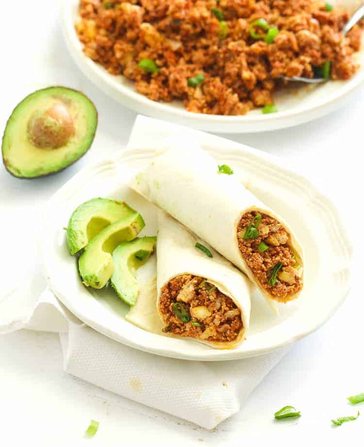 Chorizo and Eggs in a tortilla with avocado on the side