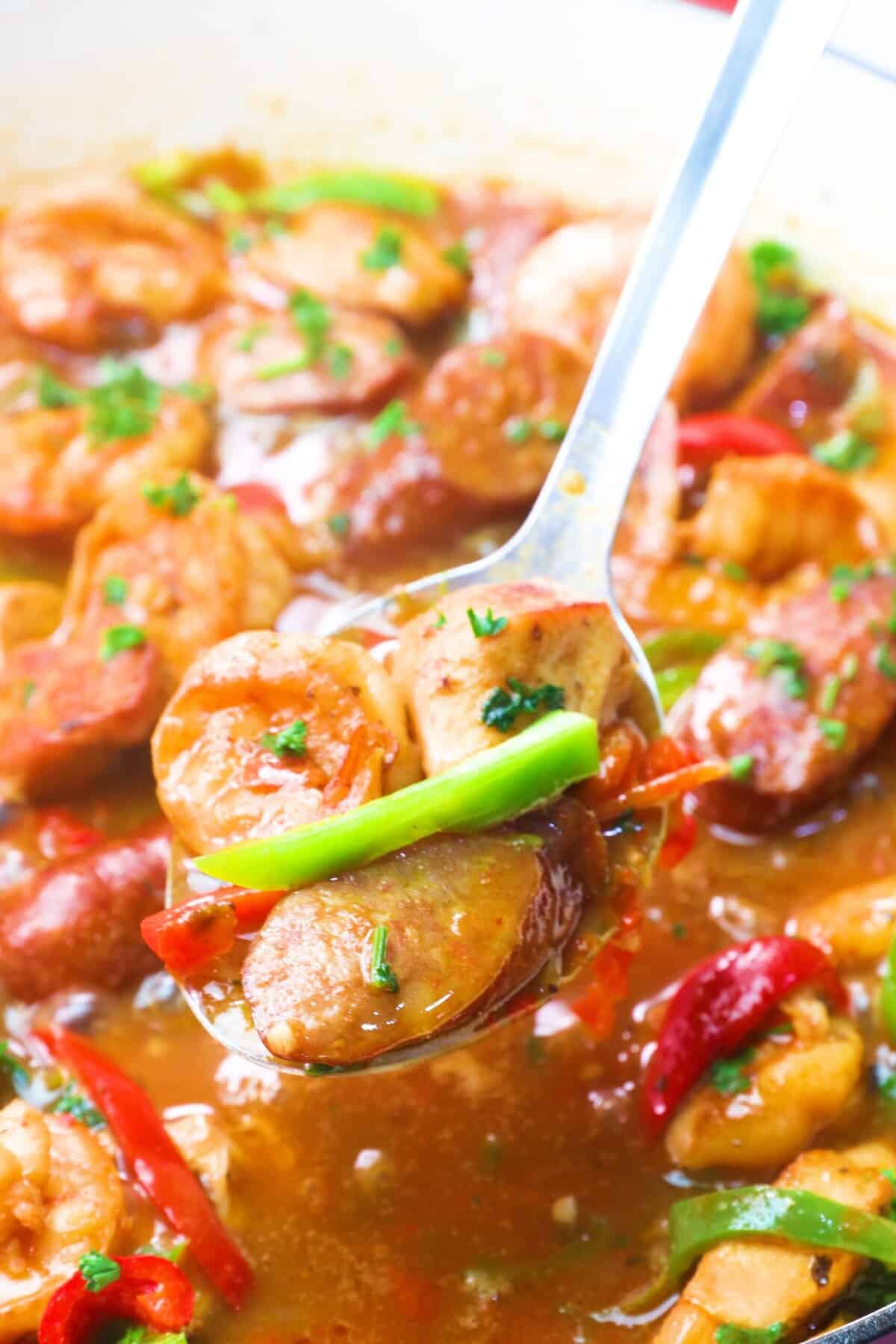 Serving up jambalaya ready to go over a bed of pasta.