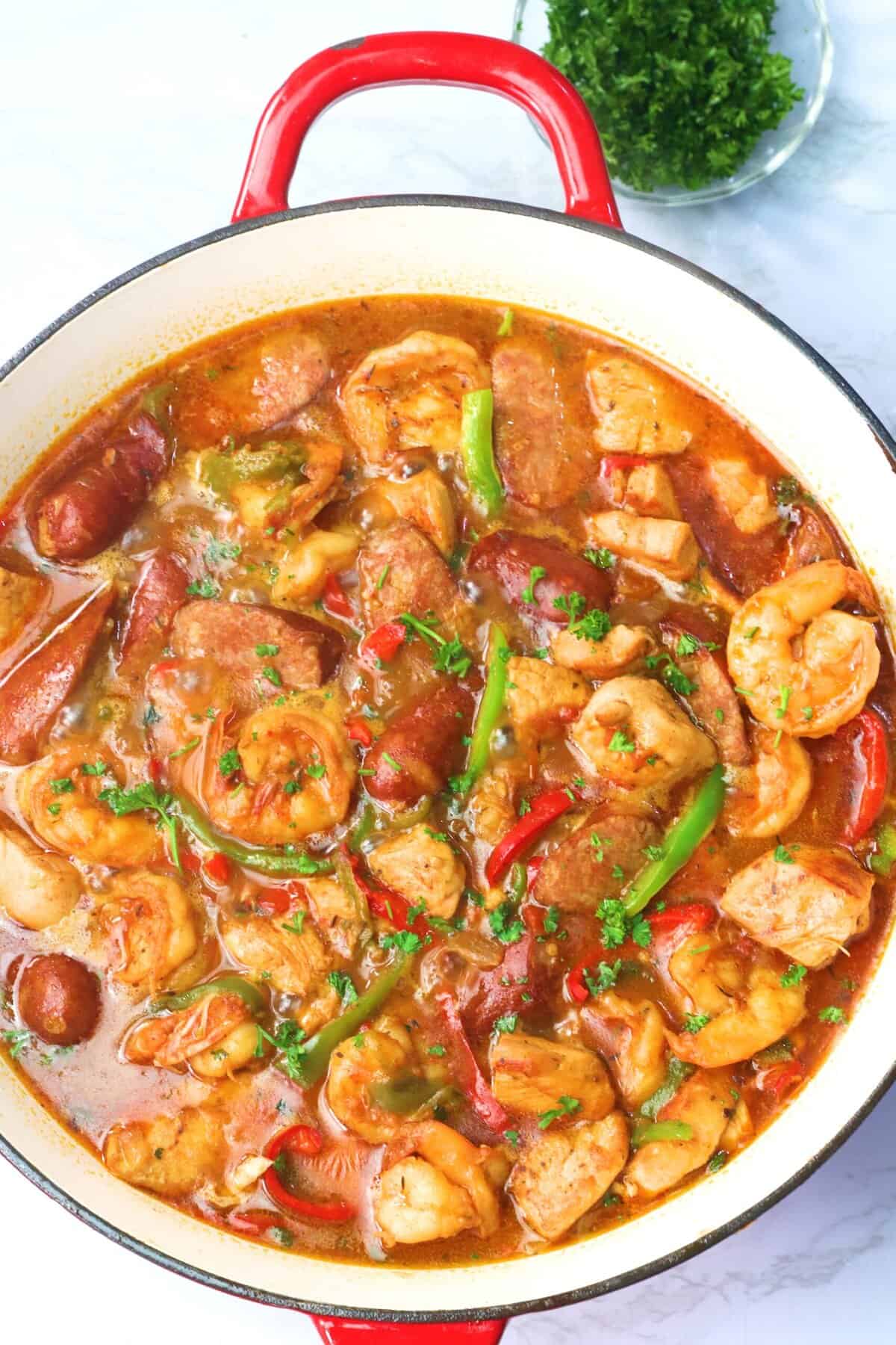 Serving up Cajun jambalaya with chicken, shrimp, and sausage over pasta.