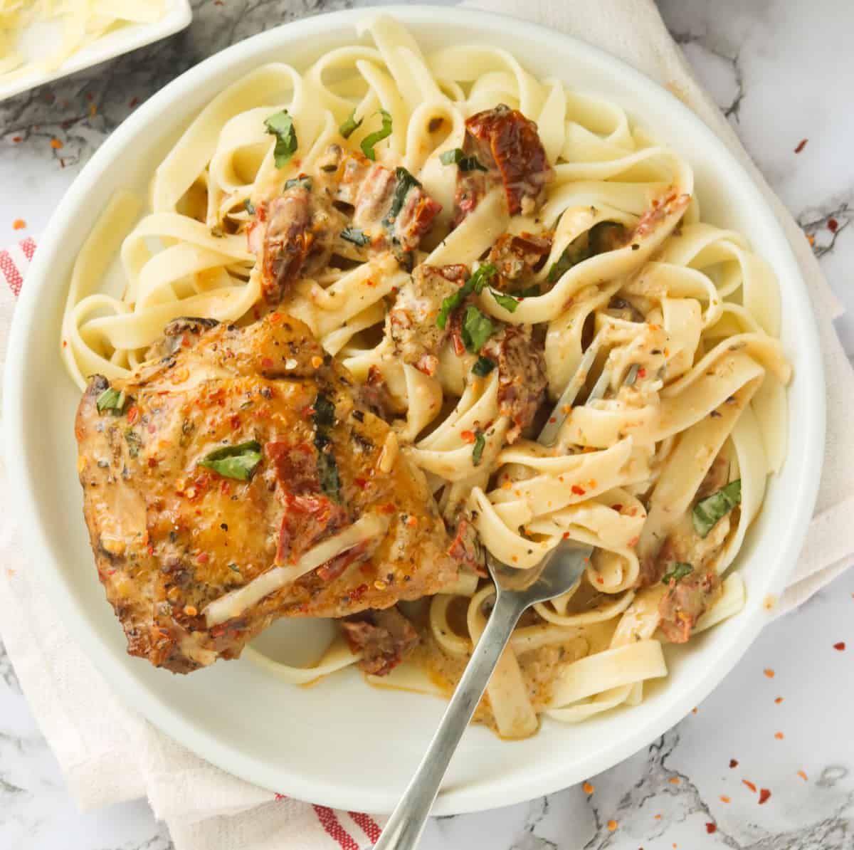 Marry me chicken in a rich creamy sauce over pasta