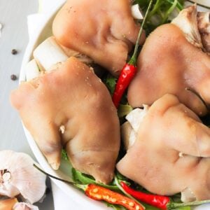 A plate of pickled pigs feet with chili peppers