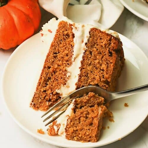 Forking into a slice of pumpkin cake.
