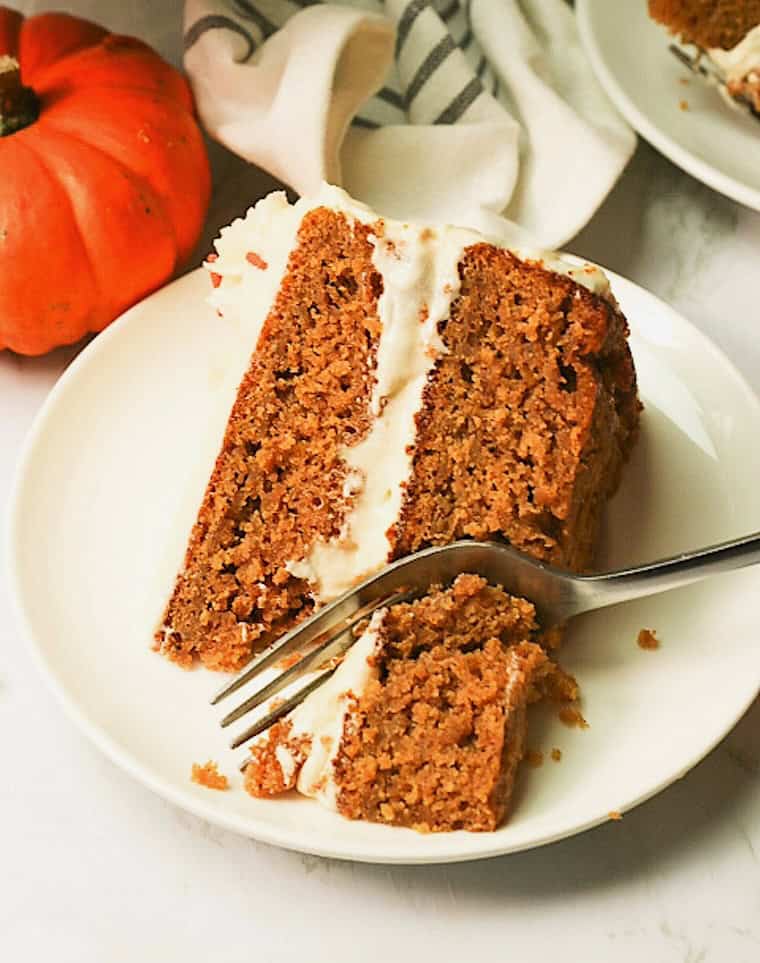 Forking into a slice of pumpkin cake.