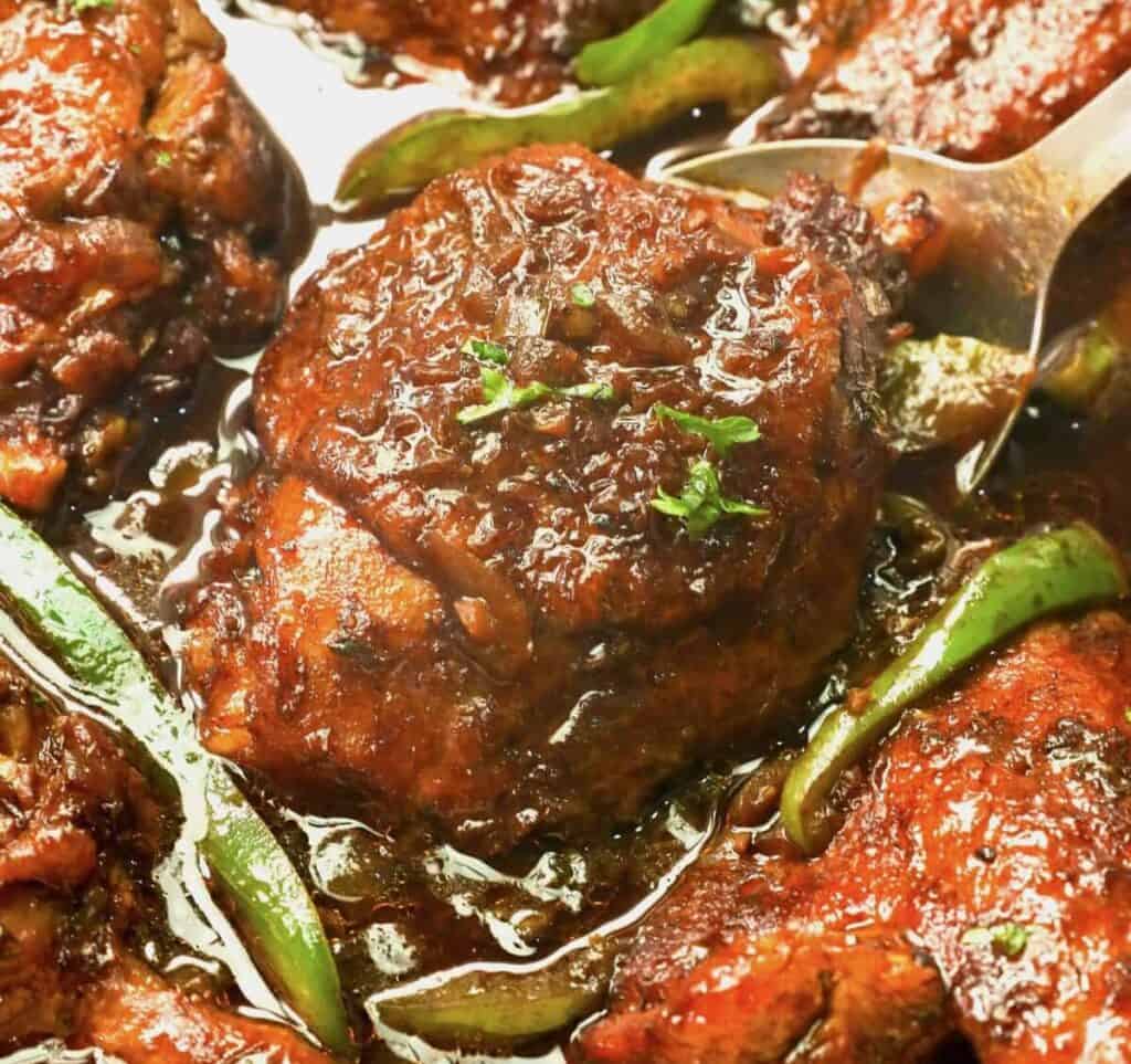 Serving up amazingly delicious brown stew chicken