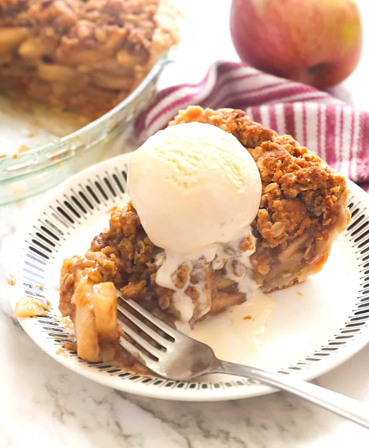 Enjoying freshly baked apple pie with vanilla ice cream.