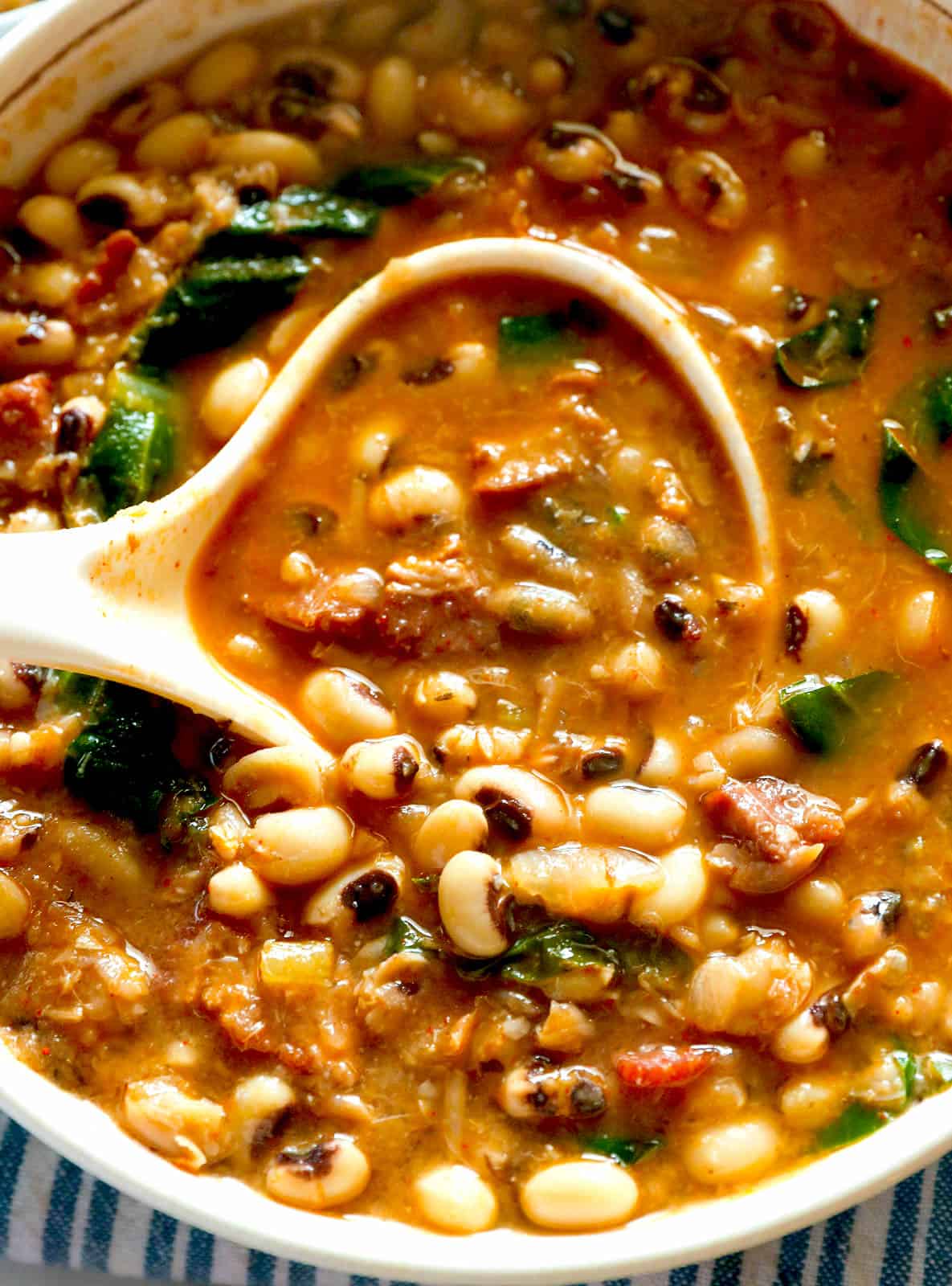 Serving black eyed pea soup closeup