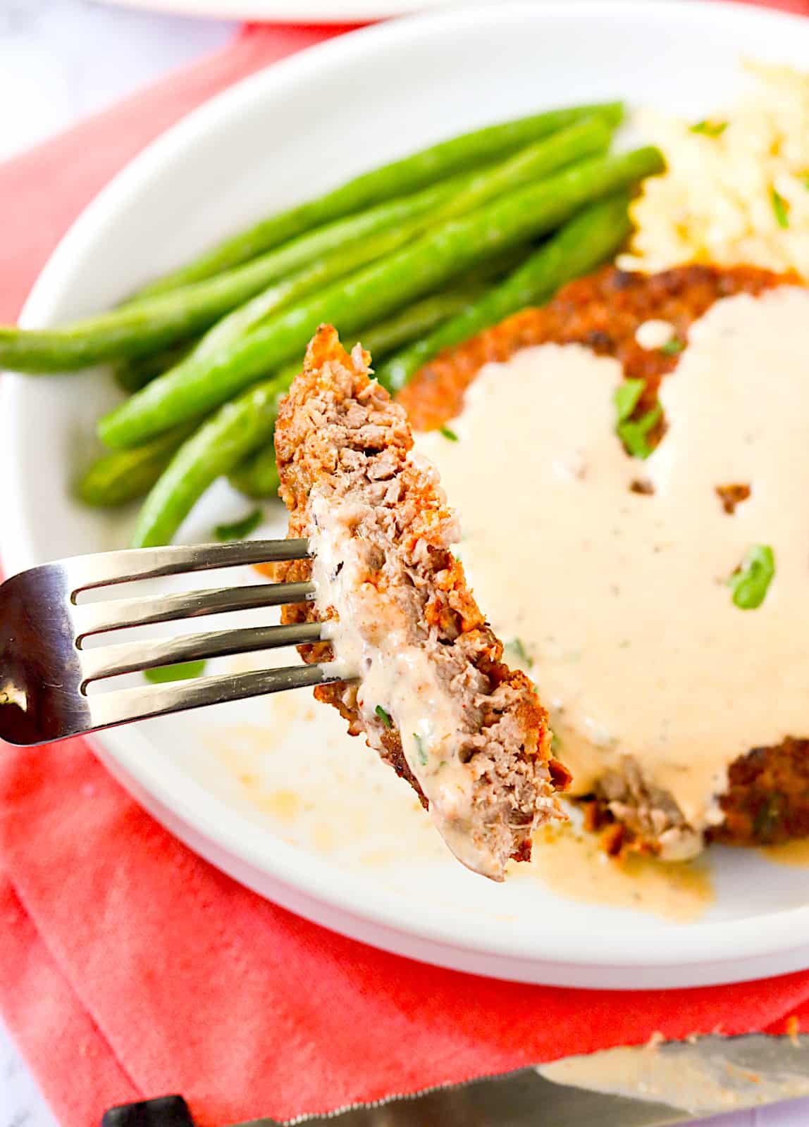 Enjoying chicken fried steak with roasted green beans 