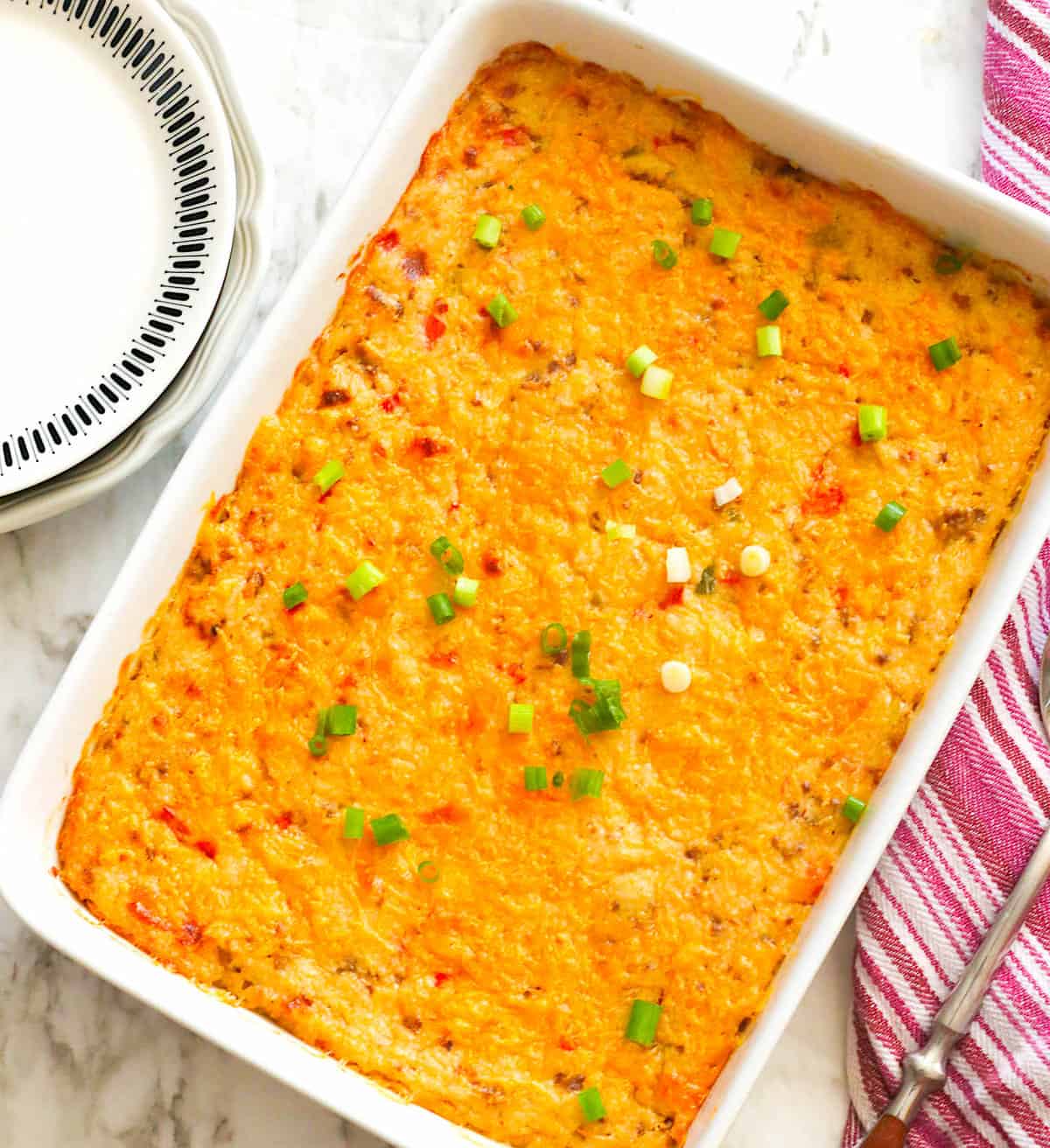 Freshly baked grits casserole topped with green onions