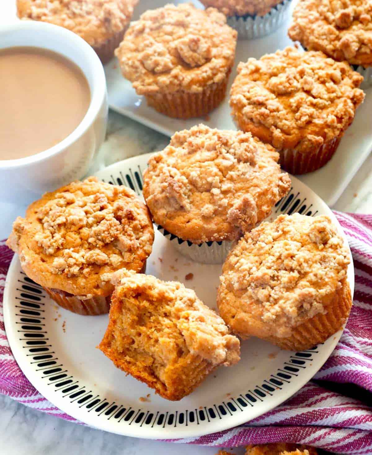 Freshly baked sweet potato muffins with streusel topping and hot coffee with cream