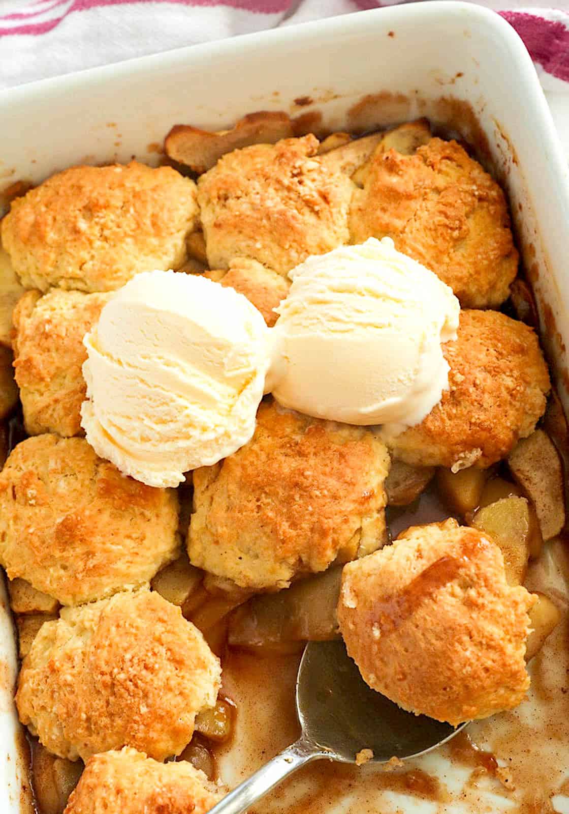 Serving comforing apple cobbler with ice cream