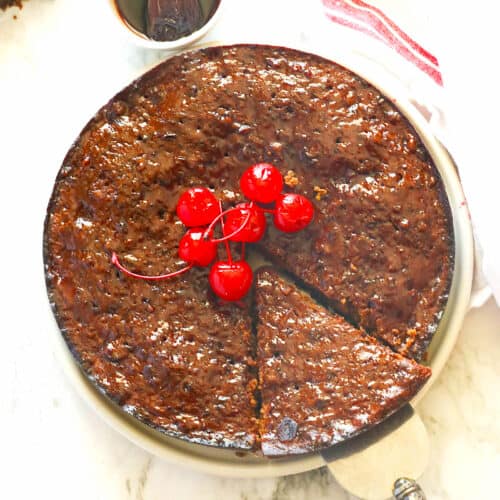 Cool and insanely delicious Caribbean Black Cake with fruit.