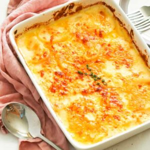 Potatoes au gratin sliced potatoes smothered in a decadent creamy, cheesy sauce