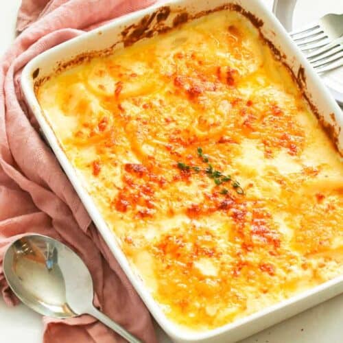 Potatoes au gratin sliced potatoes smothered in a decadent creamy, cheesy sauce