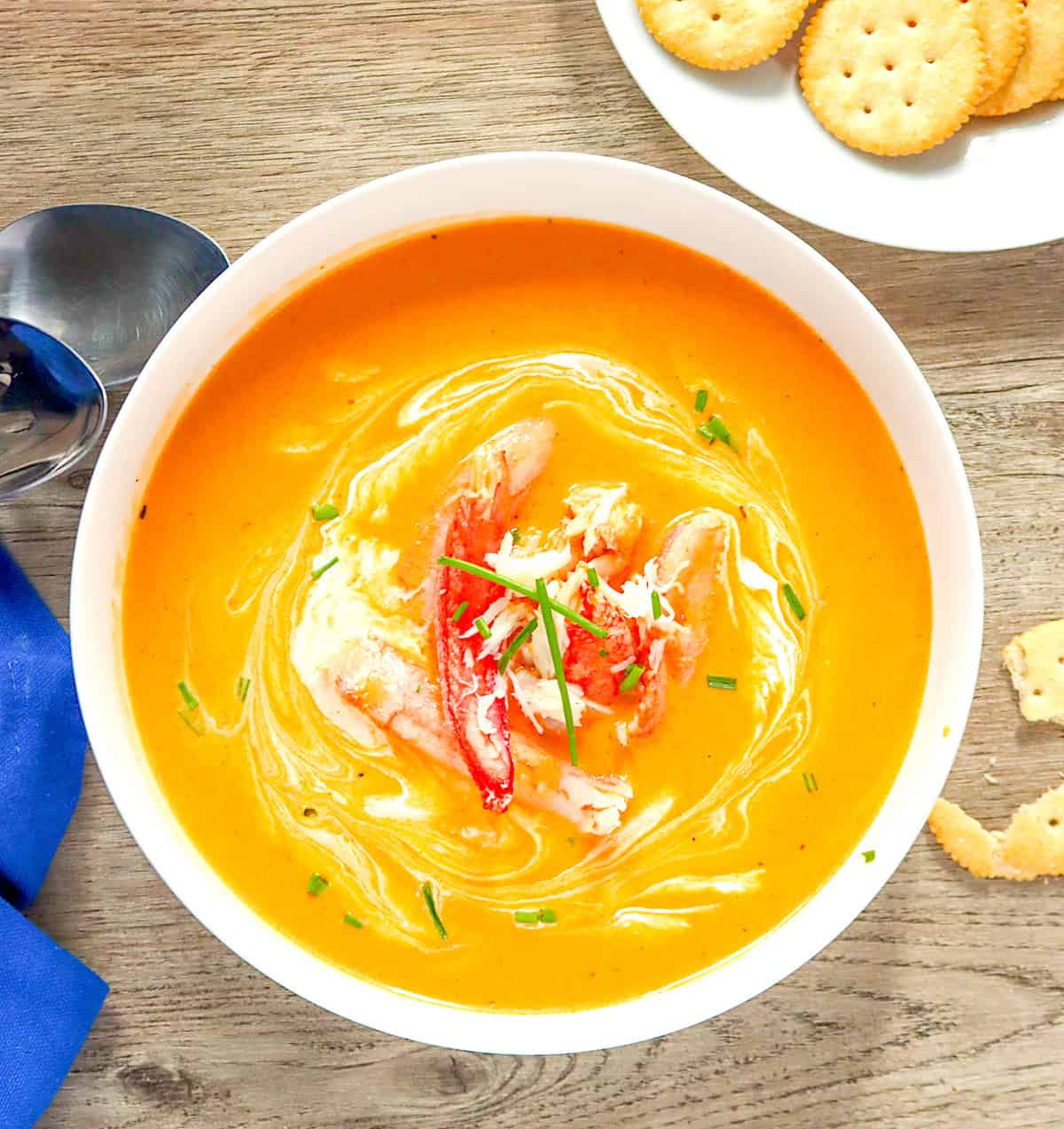 Crab bisque with crackers for an elegant dinner appetizer