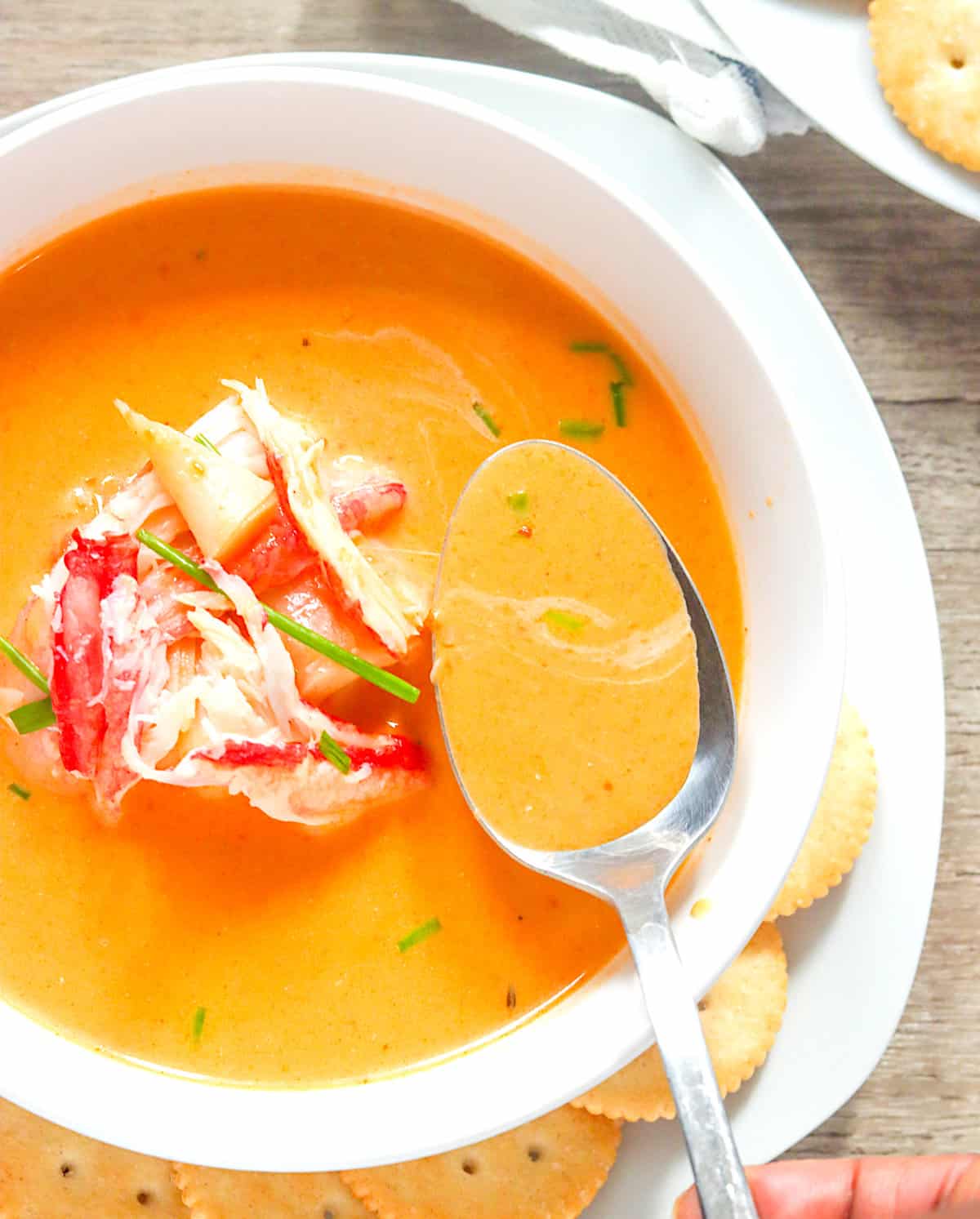 Loading up your spoon with deliciously creamy crab bisque