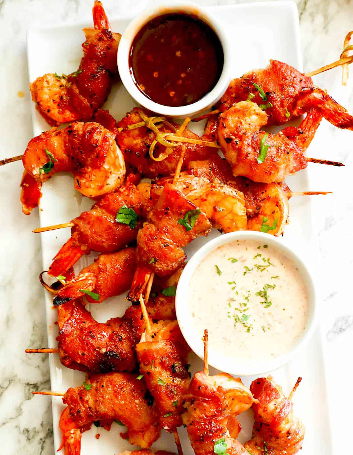 Shrimp wrapped in bacon with remoulade and hot sauce