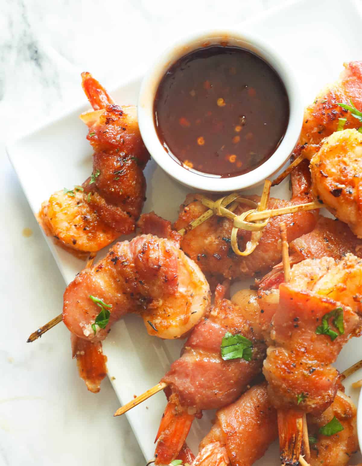 Freshly grilled shrimp wrapped in bacon with delicious sauce