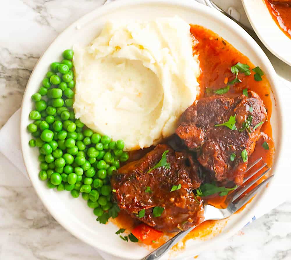 Insanely delicious lamb loin chops with mashed potatoes and peas