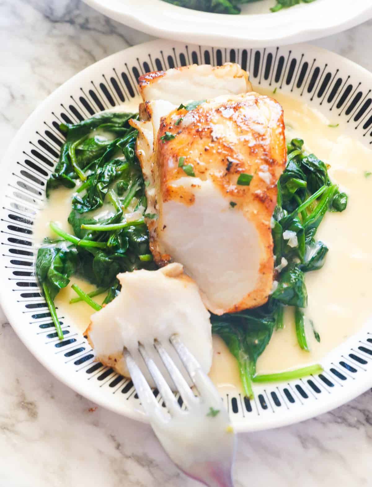 Enjoy Chilean Sea Bass with beurre blanc