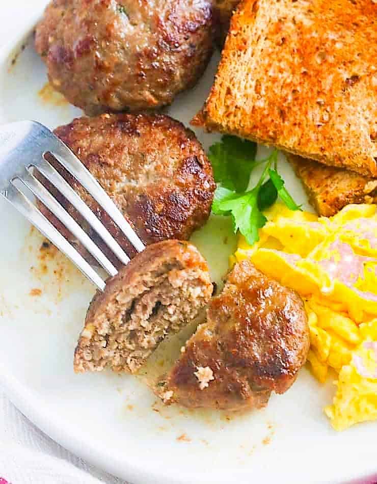 Toast, scrambled eggs, and turkey breakfast sausage for a hearty meal