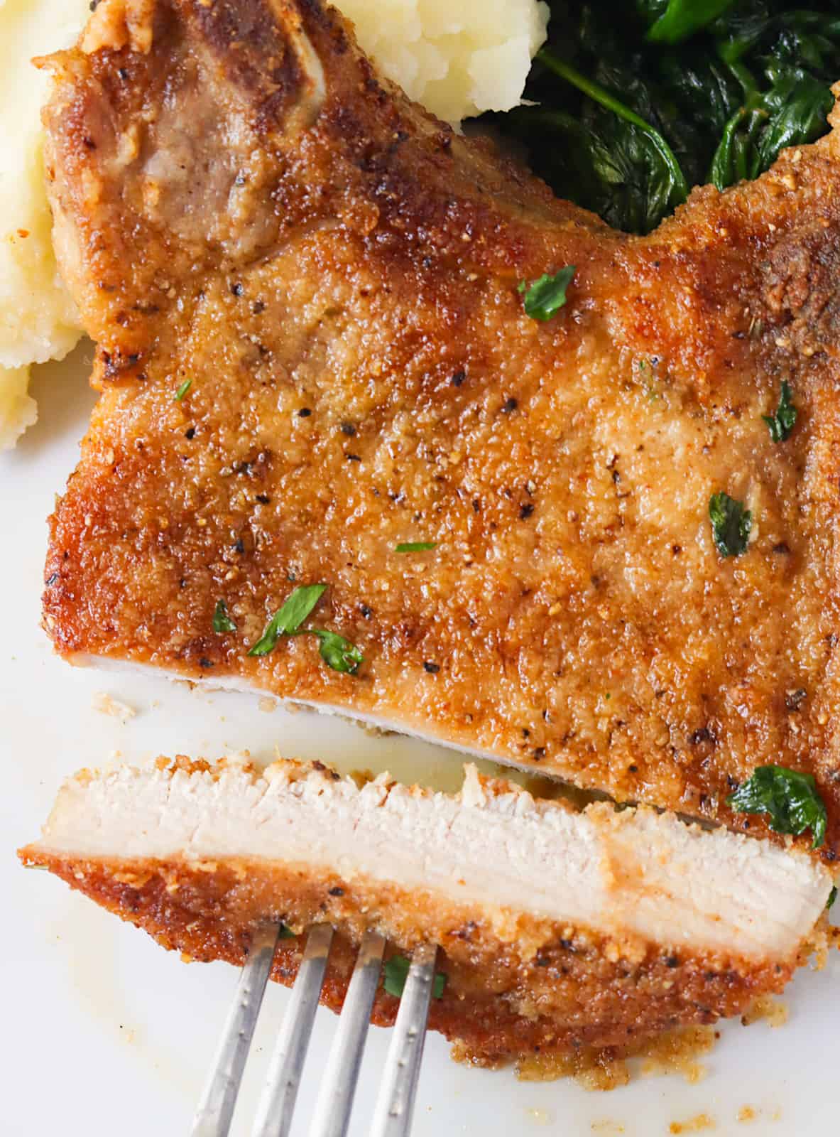 Taking a bite out of a fabulously tender fried pork chop