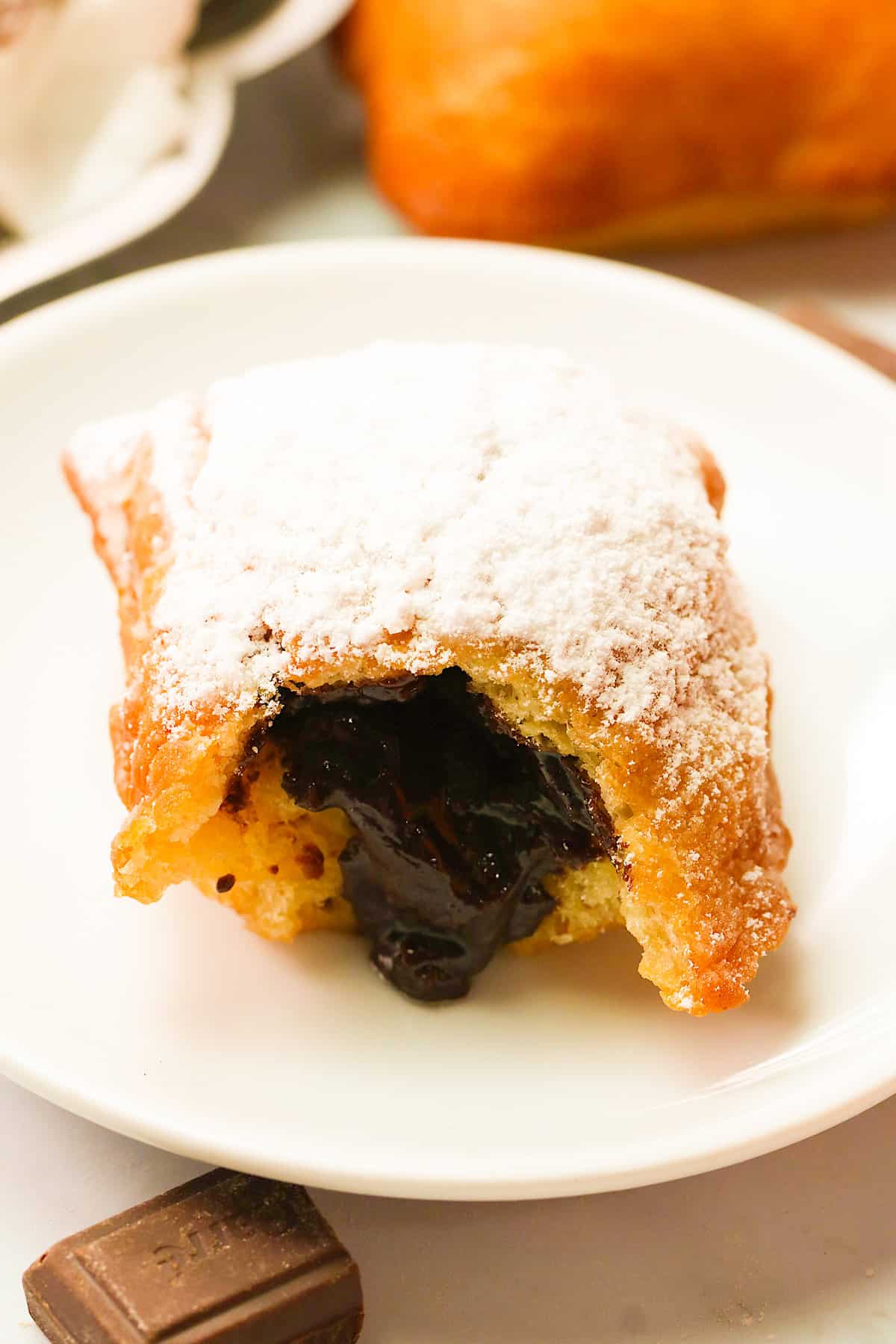 A decandent closeup of a fresh chocolate beignet