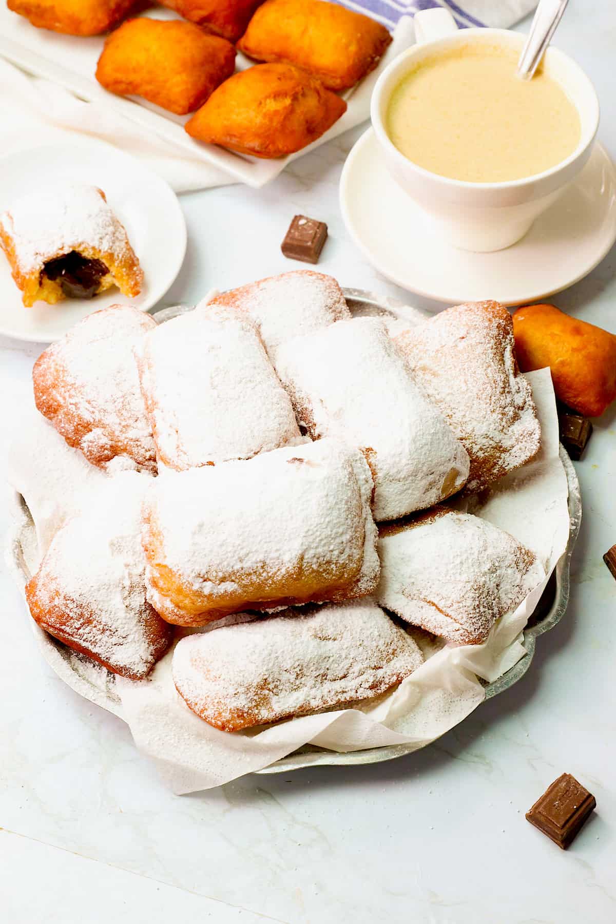 Delicious chocolate beignets and steaming cafe au latte