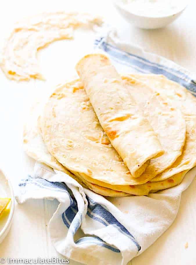 Rolling up a chapati ready to serve