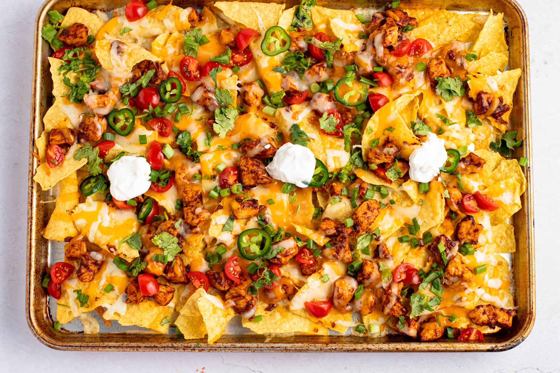 Delicious chicken nachos freshly baked in the oven