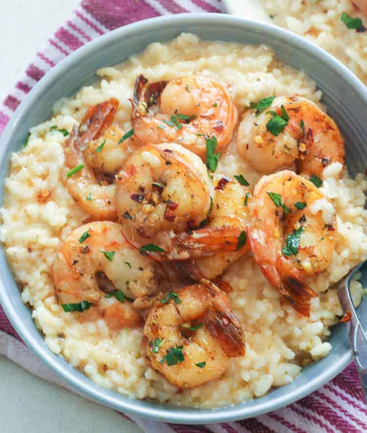 Shrimp Risotto garnished with parsley and grated Parmesan is a meal all by itself.