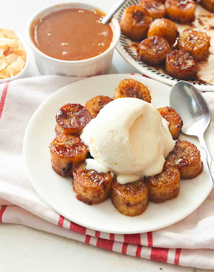 Sweetly fried bananas topped with ice cream waiting for the caramel