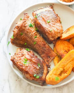 Freshly fried red snapper with plantains