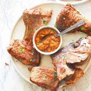 Freshly fried red snapper with hot sauce