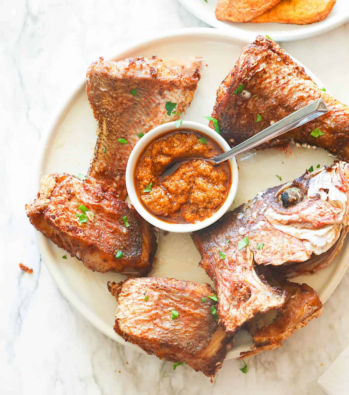 Freshly fried red snapper with hot sauce