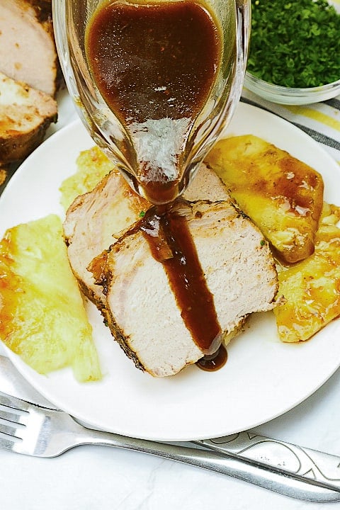 Drizzling delectable glaze of slow cooker pork loin