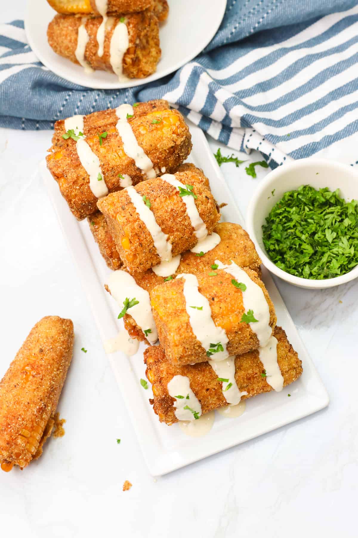 Homemade cajun fried corn on the cob with ranch dressing