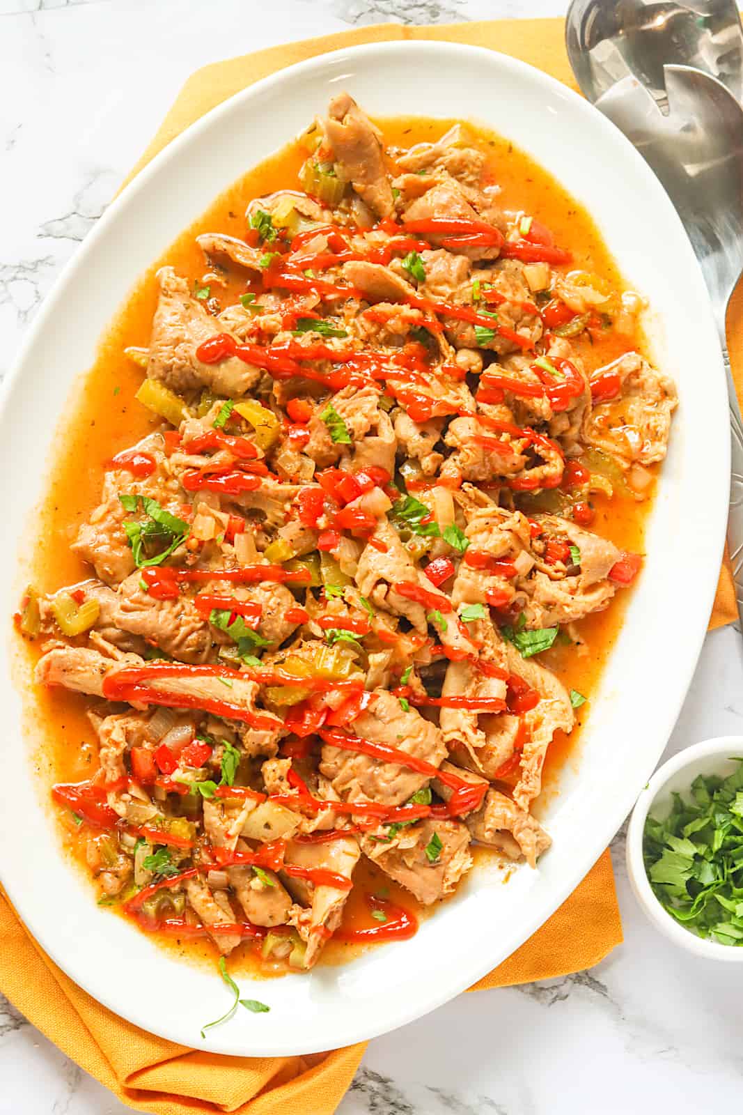 A platter of tasty Cajun pork chitterlings with hot sauce