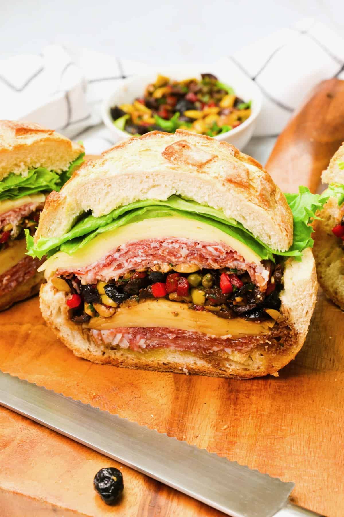 Insider's view of a crazy delicious muffaletta sandwich