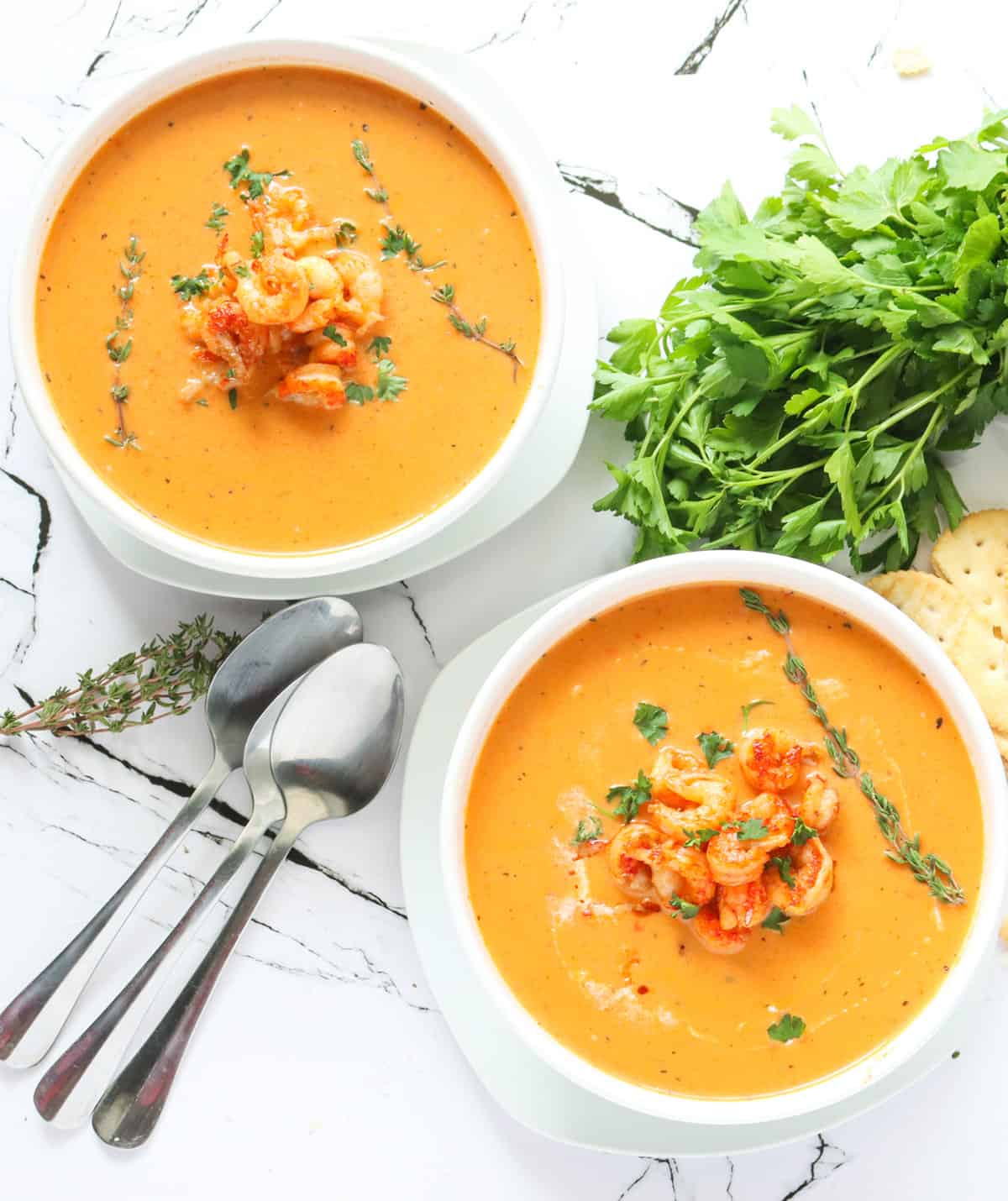 Two bowls of ridiculously delicious crawfish bisque ready to enjoy