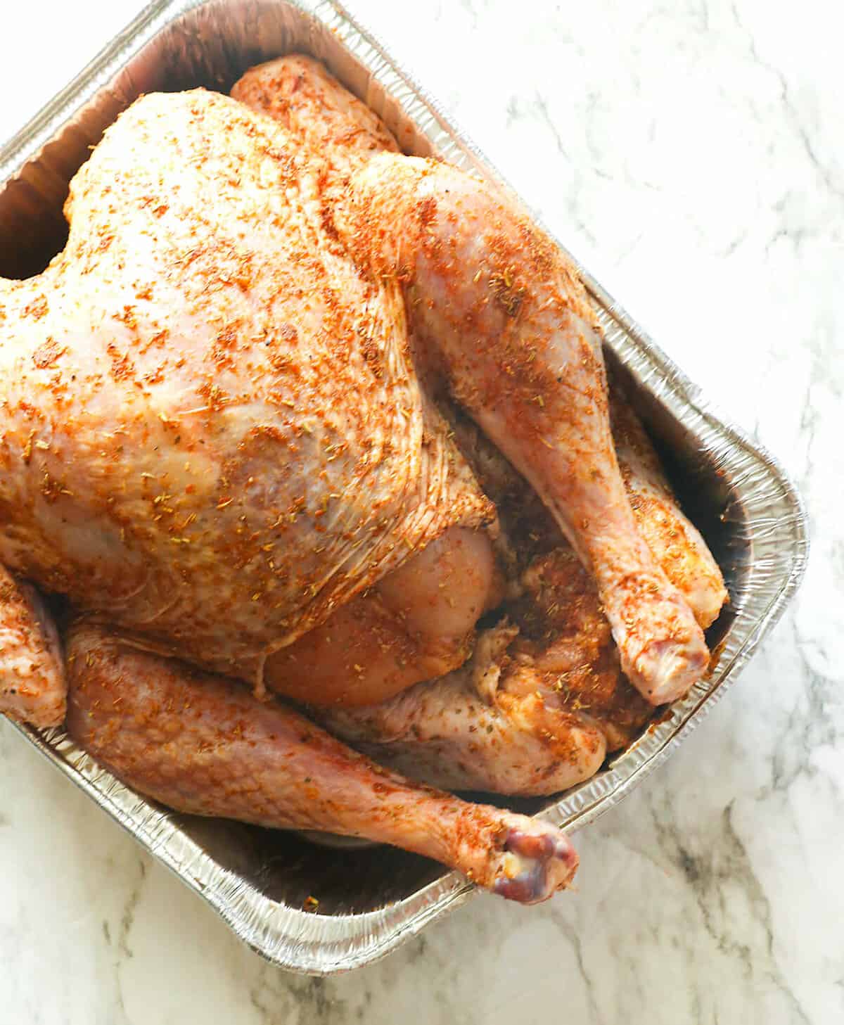 Seasoned turkey ready for the oven