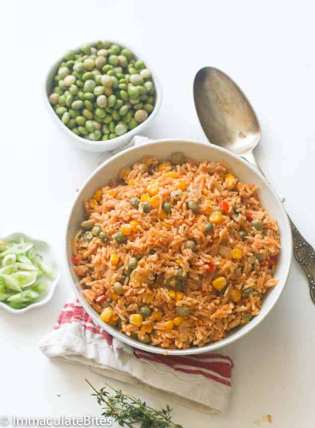 Mouthwatering pigeon peas and rice in a bowl ready to eat with a spoon